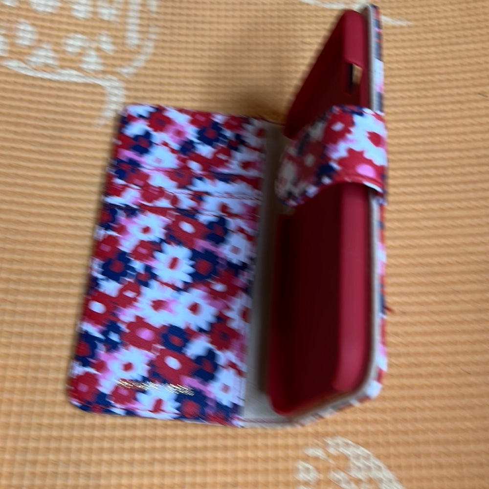 Brand new iPhone XS Michael Kors phone case never used. Multi colored fun to use